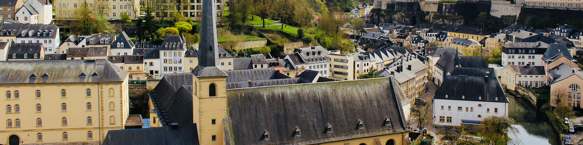 About us heading image showing a roof view of Luxembourg city