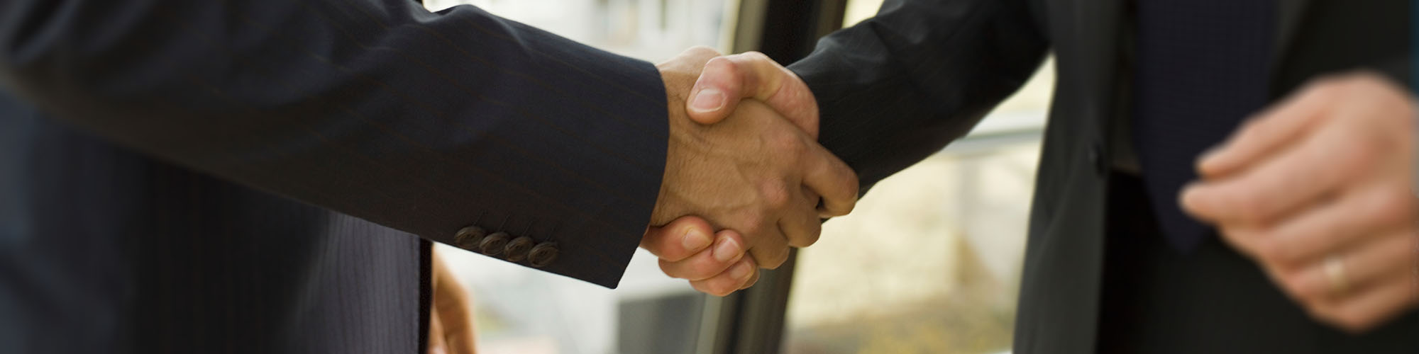 Management heading image showing an handshake