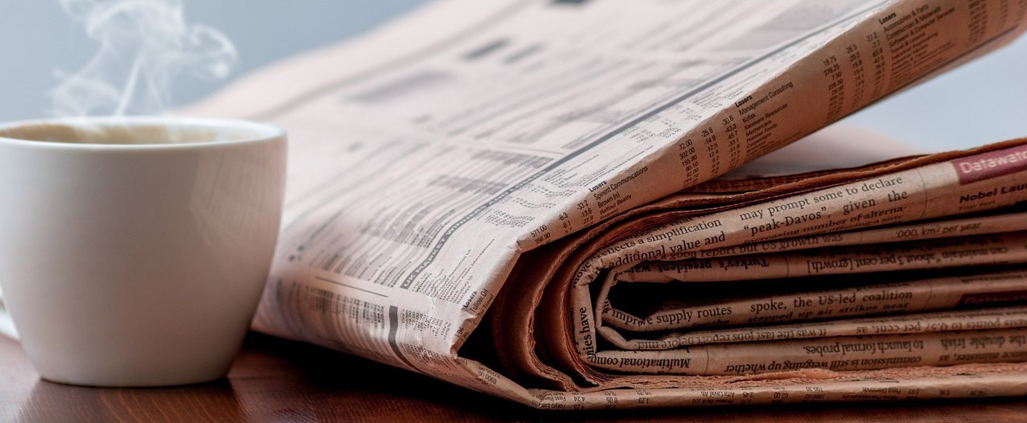 News masterpage heading image showing a newspaper and a coffee